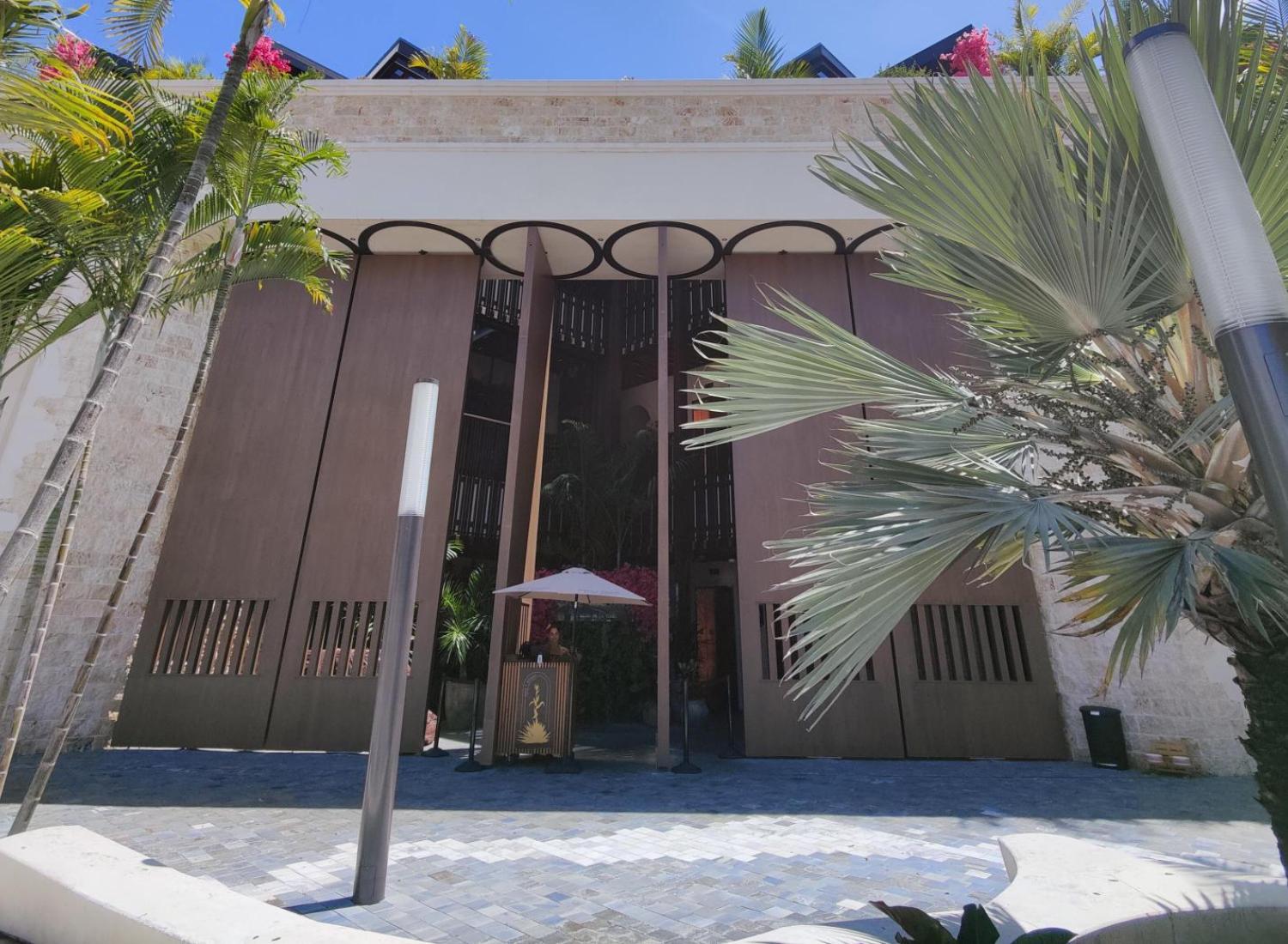 Front of Maiz and Agave store, clean sidewalk, sunny day blue sky above